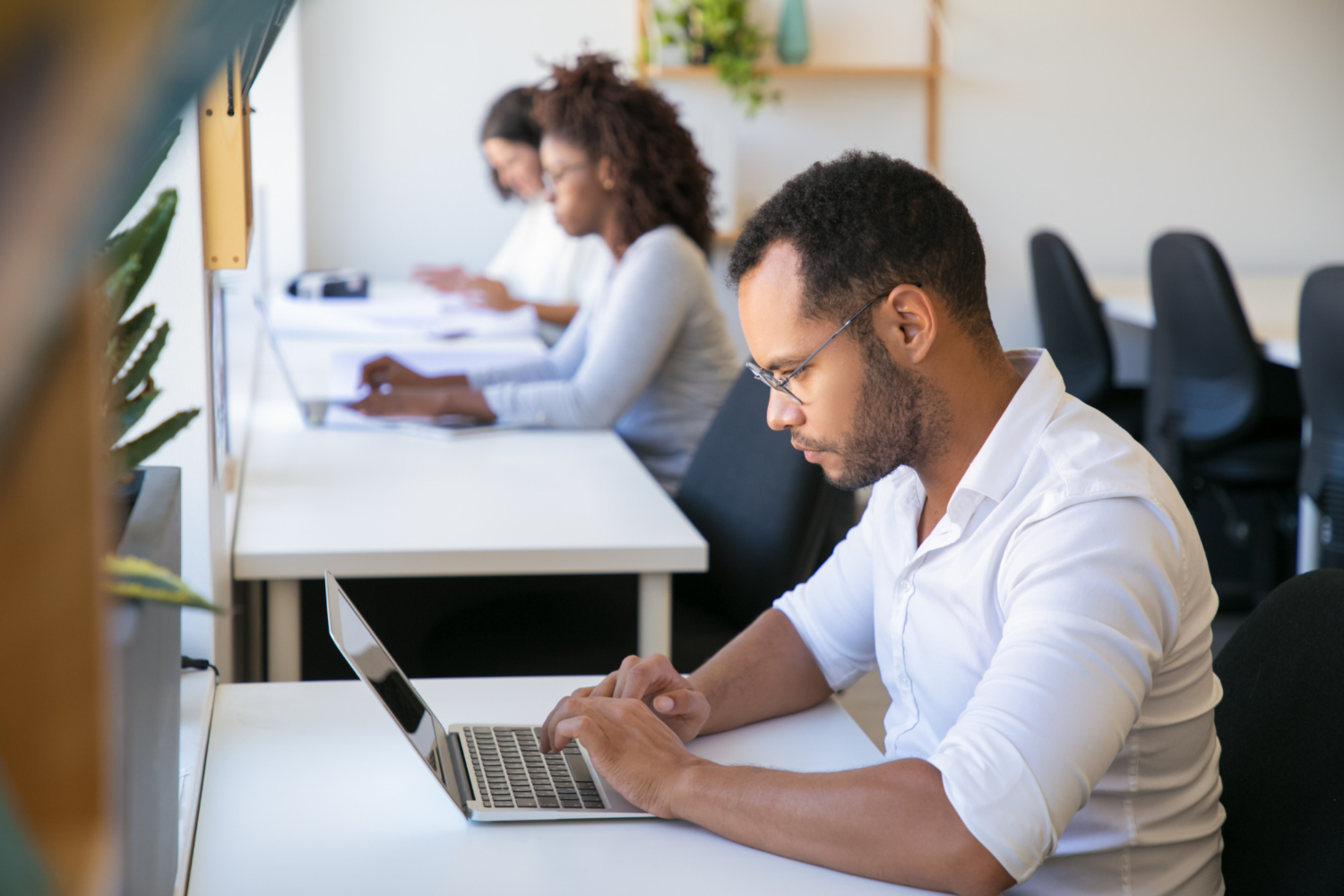 confident-diverse-team-working-project-office